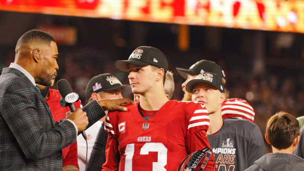 Jan 28, 2024; Santa Clara, California, USA; Fox Sports broadcaster and former NFL player Michael Strahan interviews San Francisco 49ers quarterback Brock Purdy (13) after winning the NFC Championship football game against the Detroit Lions at Levi's Stadium. Mandatory Credit: Kelley L Cox-USA TODAY Sports